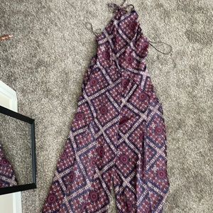 Sage jumpsuit with open back & legs. New w/ tag.